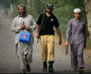 three polio vaccination workers
