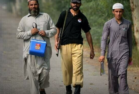 three polio vaccination workers